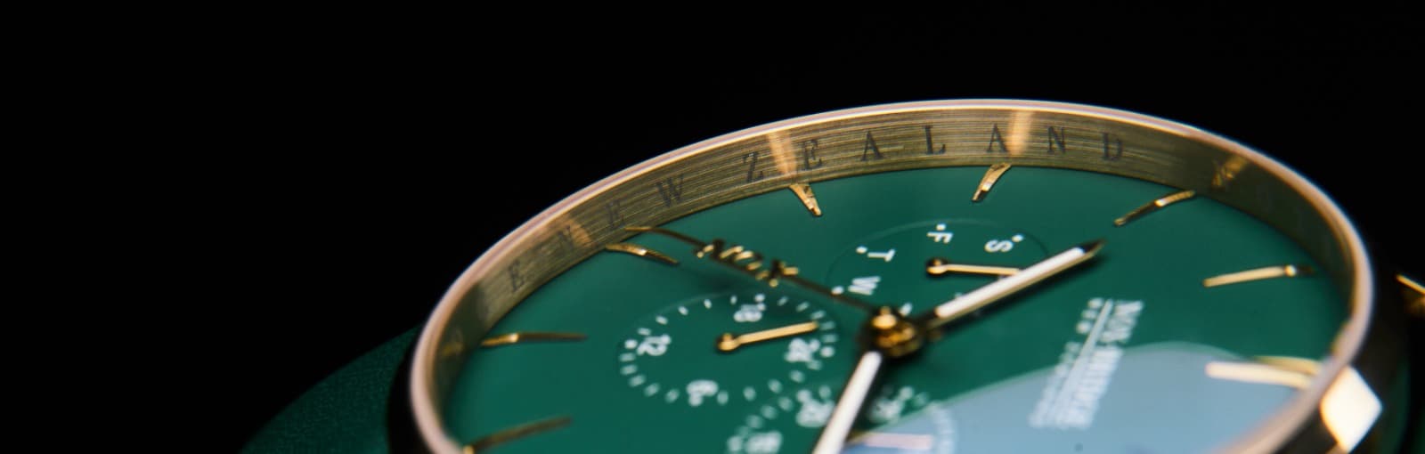 Close-up of a custom NOX-BRIDGE New Zealand green watch dial