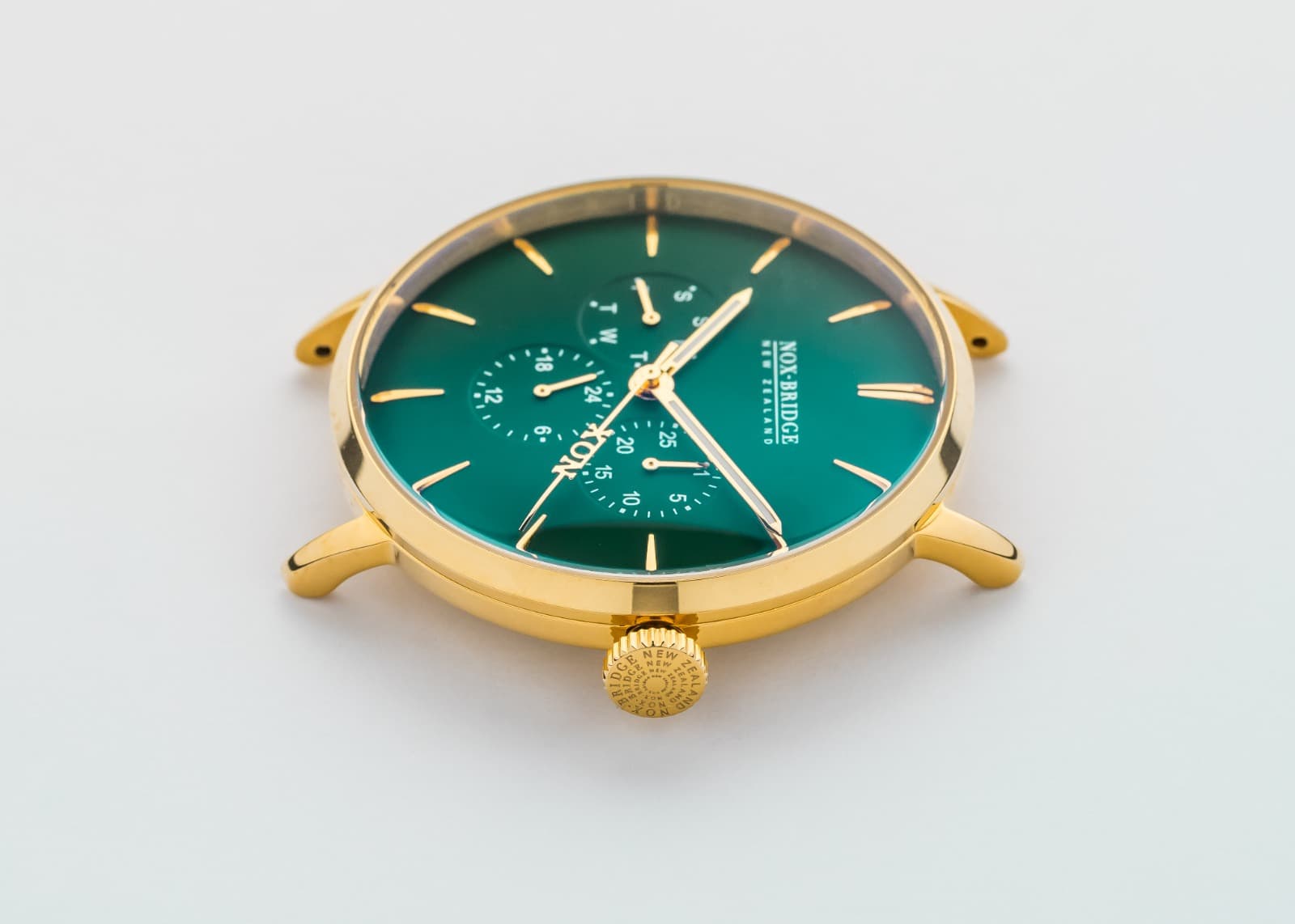 Finished custom NOX-BRIDGE watch with a green dial and gold case
